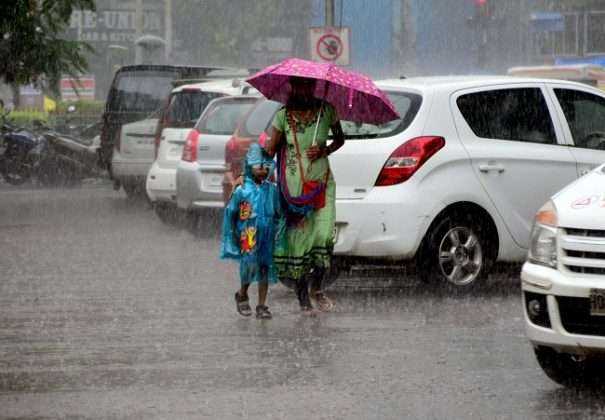 student going to school in heavy rain