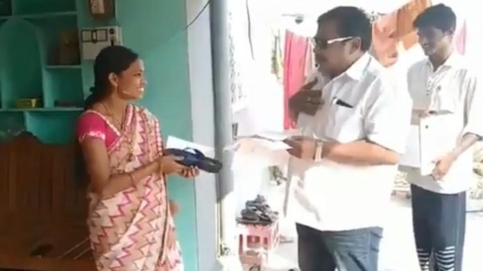 candidate hands over slippers to voters for hit him if he fails his promise