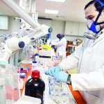Forensic scientists analyze samples in the Toxicology department at Punjab Forensic Science Agency in Lahore