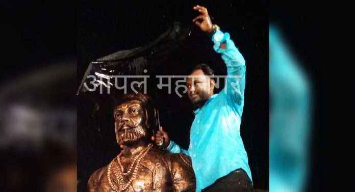 one follower of Chhatrrapati Shiwaji maharaj stand in rain and protect the statue of Shivaji maharaj