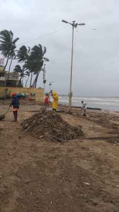 bmc workers clean beaches