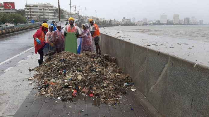 high tide spills garbage along mumbai beaches bmc workers cleared