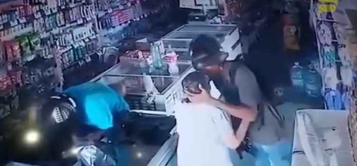 Thief kisses old woman on forehead while robbing store. Viral video tells you why