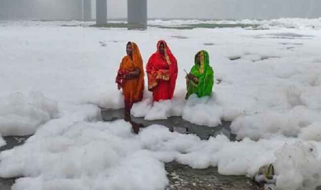 Women praying for the Puja