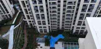 Homebuyers promised ‘park views’ from new development get bright blue plastic lake instead