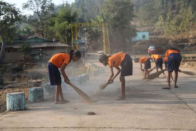 cleaning village by student