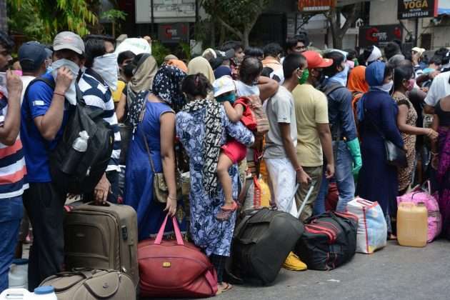 Thousand of Migrant workers from Mumbai queue up to board Shramik Special train outside CSMT