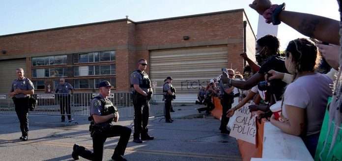 Oklahoma City police on their knees (Reuters)