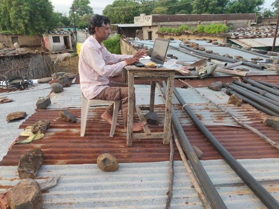 to get good internet speed csc employee form washim filling insurance form of farmers from his roof picture goes viral