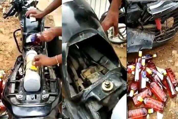 man arrested for carrying illegal alcohol bottles in bike in dry state gujarat watch video