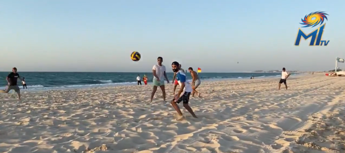 ipl 2020:mumbai indians players indulge in beach football to beat heat in uae
