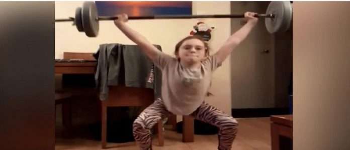 10 year old girl is surprised to see weight lifting video dreams of going to olympics