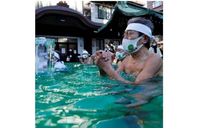 Japanese pray for end to pandemic in annual ice bath ritual at Tokyo shrine