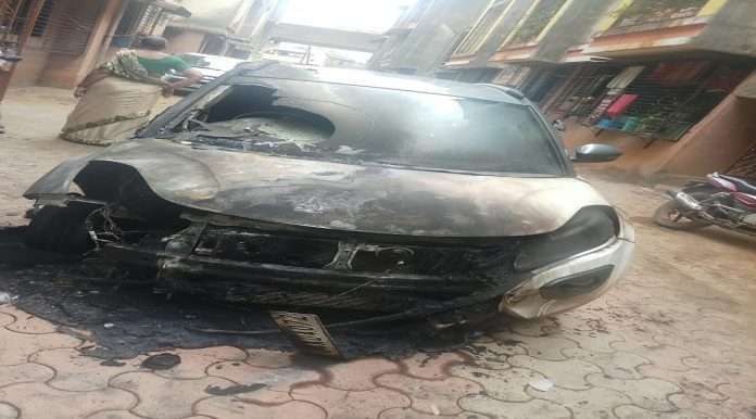 Ashes in motorcycle fire with car in Shapur