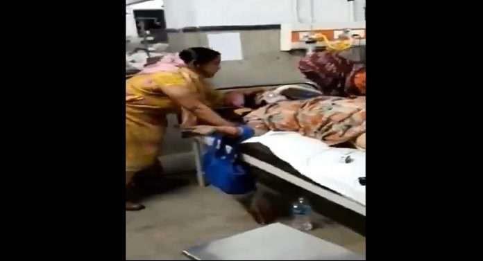 watch viral video family member removed oxygen cylinder performed pooja in covid ward kanpur hospital uttar pradesh