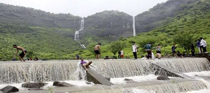 Three tourists carried in the flow of the khopoli zenith waterfall