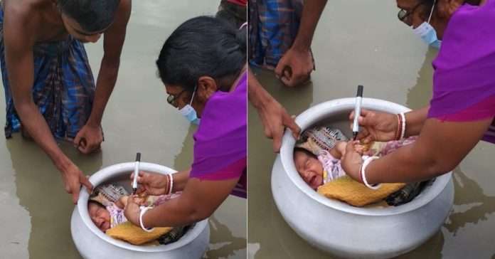 Amidst the flood waters, the polio dose given to the newborn child in a pot photo viral