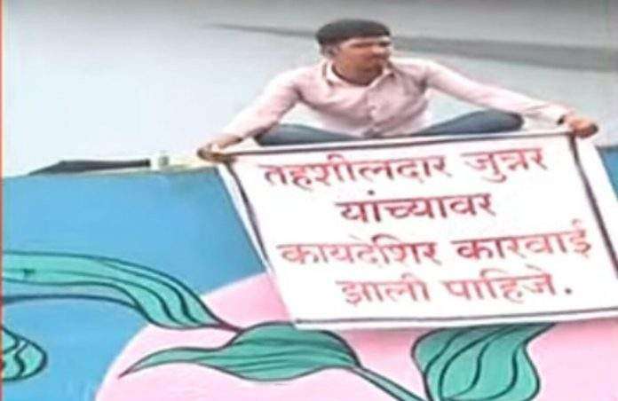 Demanding action against Tehsildar, protest of young man climbing bridge in Pune PPK